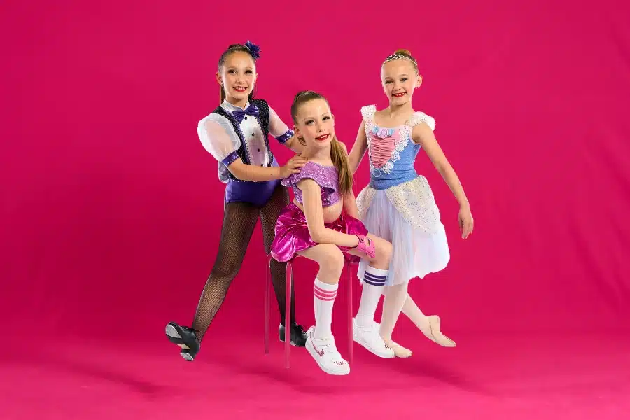 Trio-of-Young-Dancers-in-Vibrant-Costumes Trio-of-Young-Dancers-in-Vibrant-Costumes